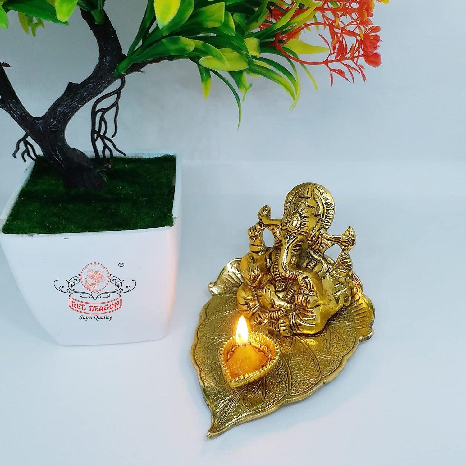 Metal Lord Ganesha on Leaf with Diya Statue For Pooja, Home Décor & Gifts Purpose - Walgrow.com