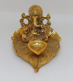 Metal Lord Ganesha on Leaf with Diya Statue For Pooja, Home Décor & Gifts Purpose - Walgrow.com